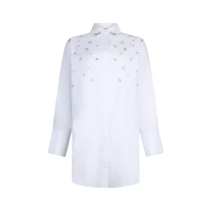 Abito bianco impreziosito con ricami gioiello